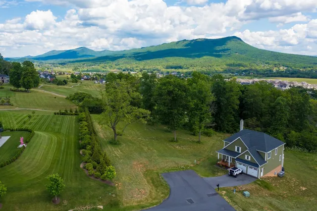 a view of a garden with a building in the background
