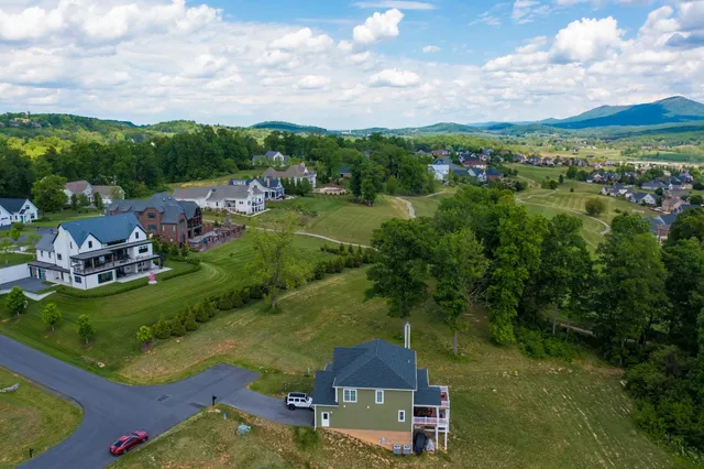 an aerial view of a house with a garden