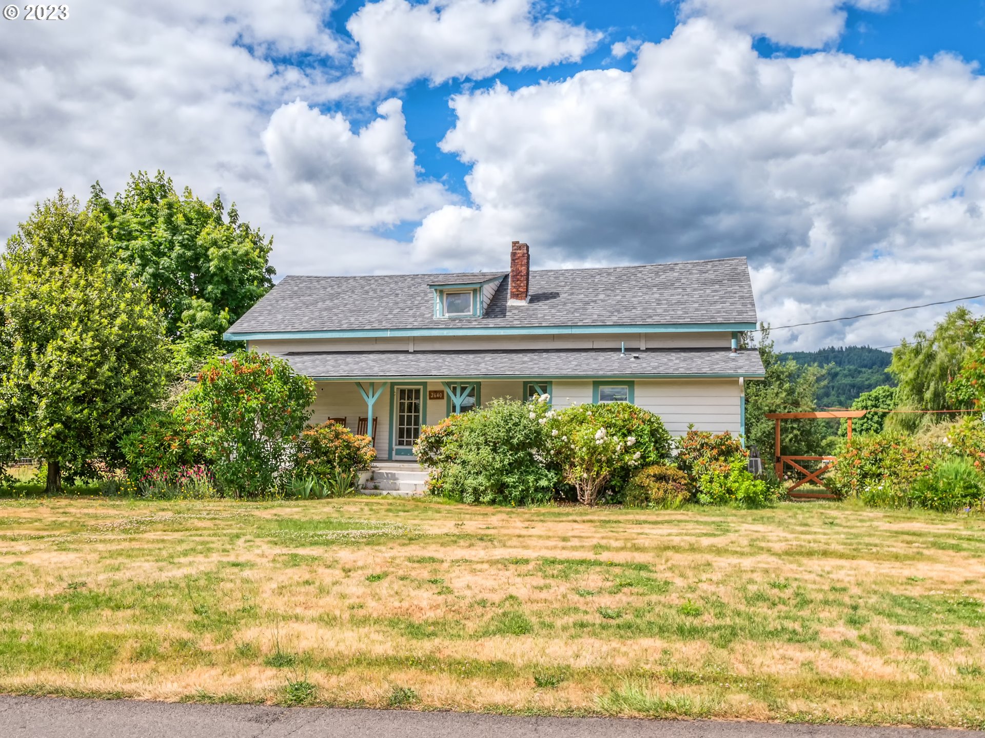 2640 Hayden Bridge Road Springfield, OR 97477 - Photo 1 of 46 a front view of a house with a yard