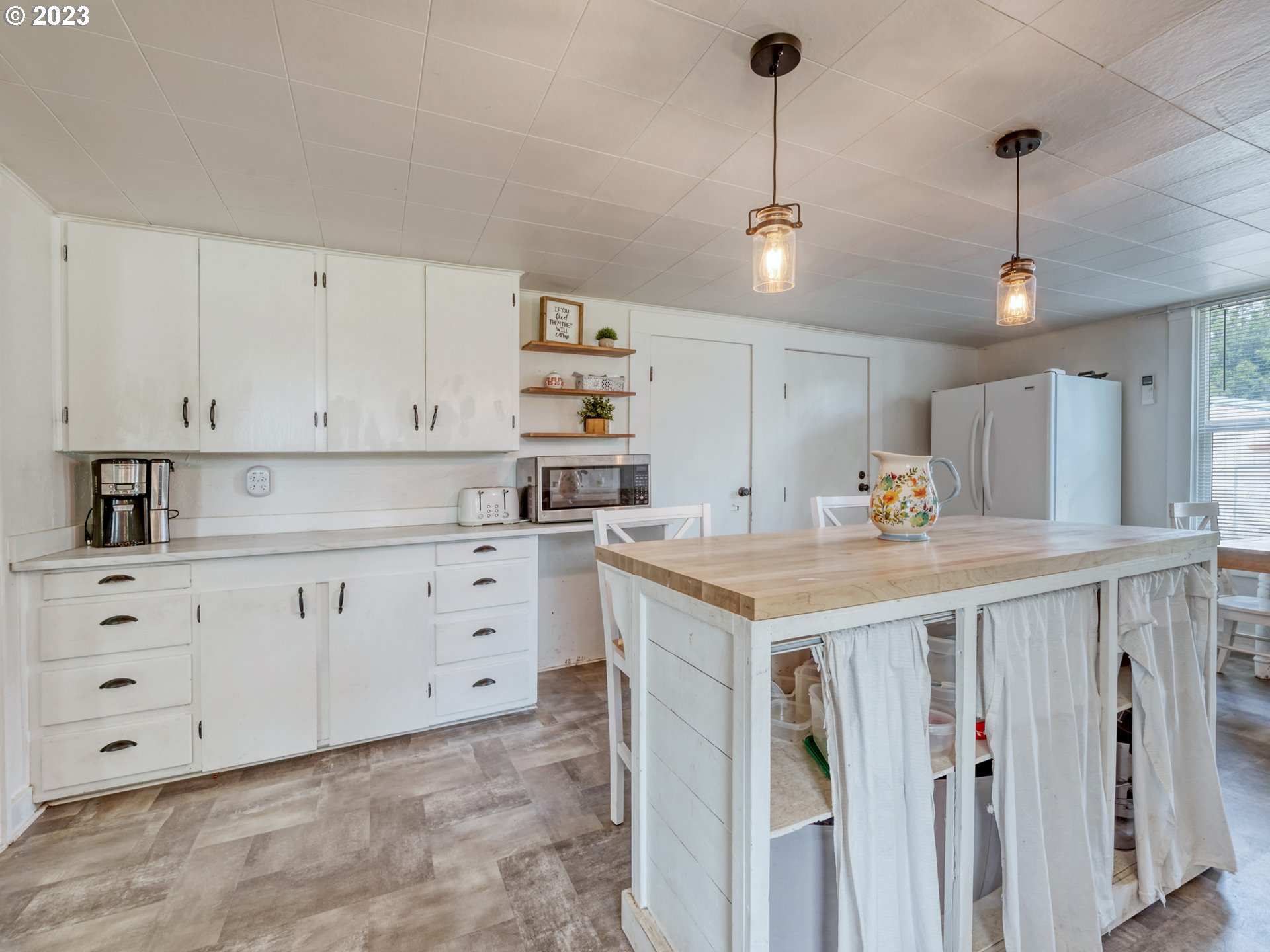2640 Hayden Bridge Road Springfield, OR 97477 - Photo 11 of 46 a kitchen that has a lot of cabinets in it