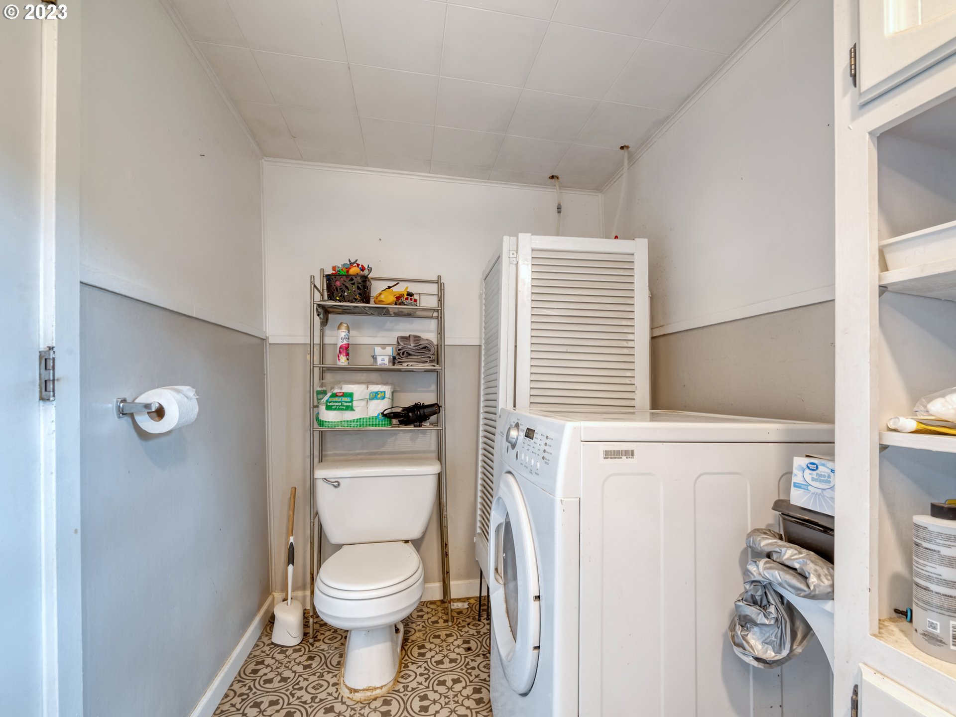 2640 Hayden Bridge Road Springfield, OR 97477 - Photo 16 of 46 a white toilet sitting next to a bathroom sink and vanity