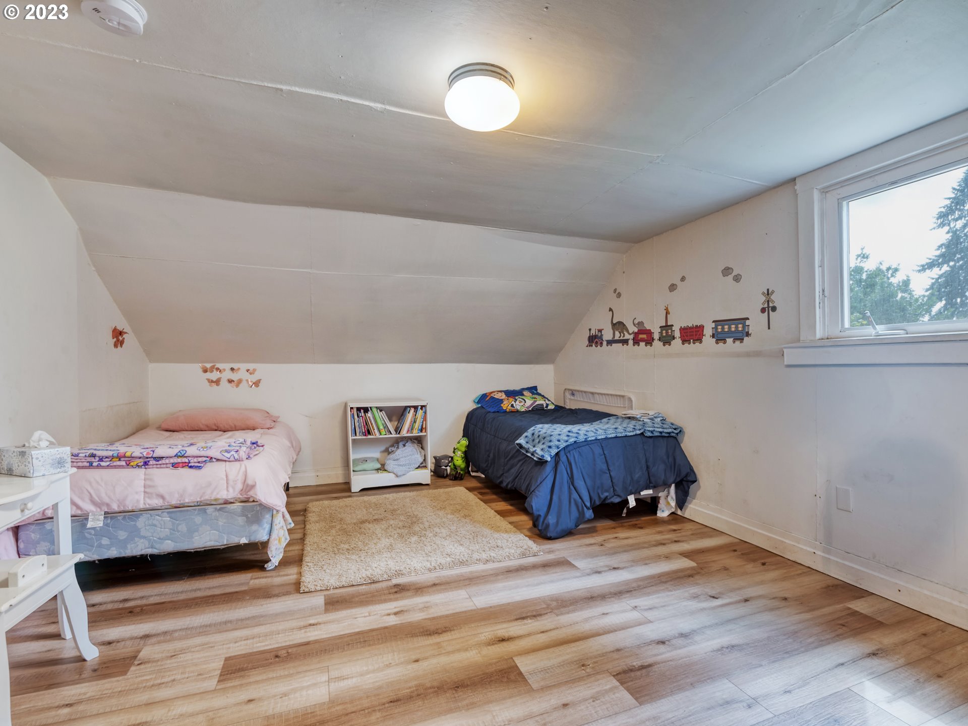2640 Hayden Bridge Road Springfield, OR 97477 - Photo 23 of 46 a bedroom with a bed and a window