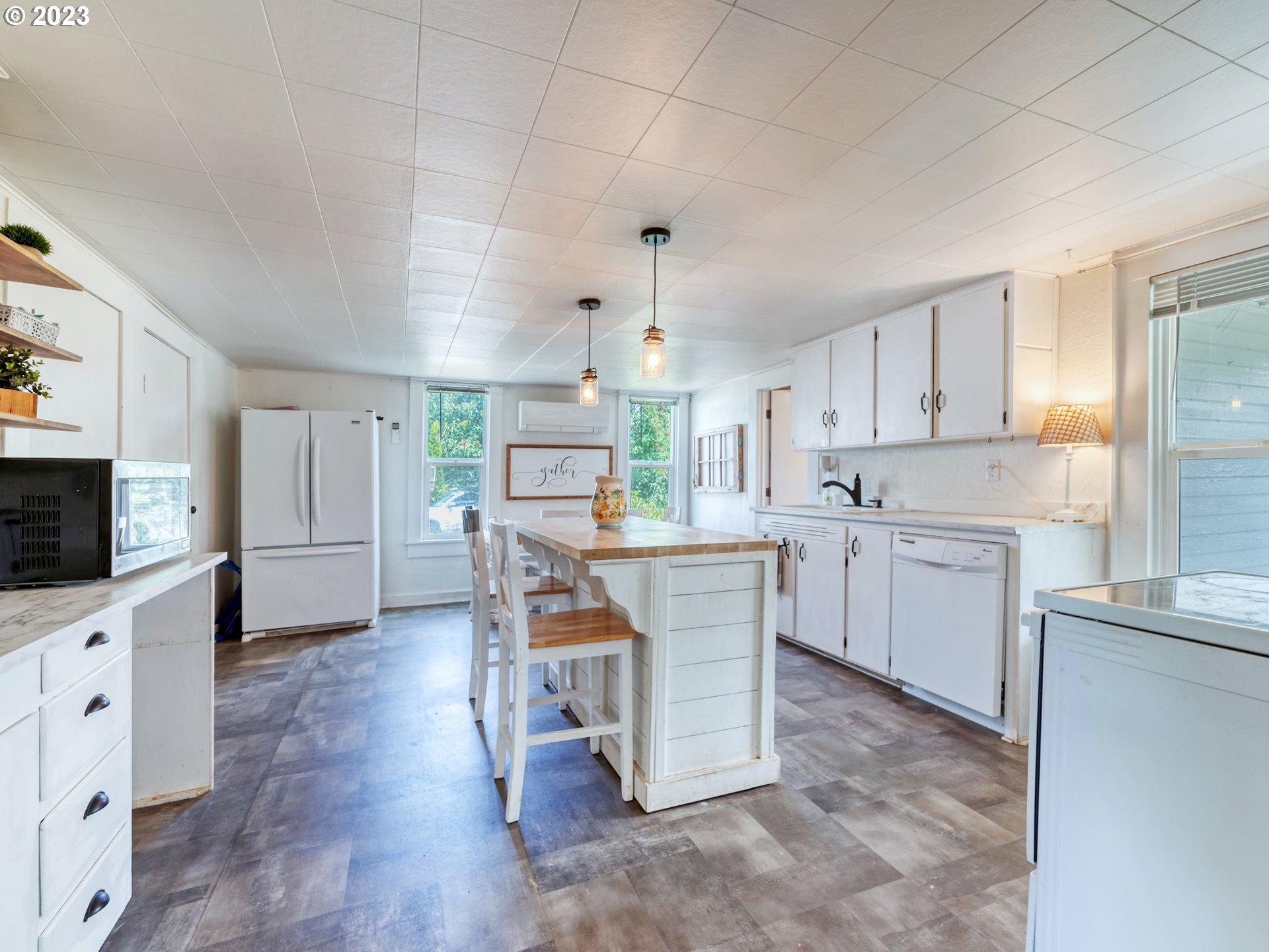 2640 Hayden Bridge Road Springfield, OR 97477 - Photo 8 of 46 a kitchen with cabinets and wooden floor