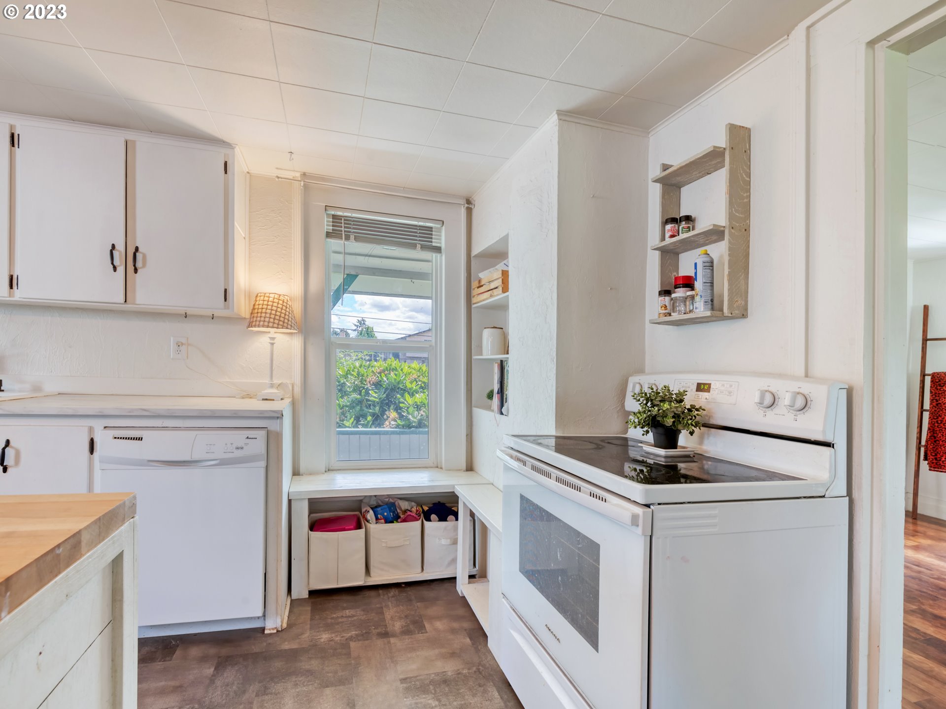 2640 Hayden Bridge Road Springfield, OR 97477 - Photo 9 of 46 a kitchen with a stove and a microwave