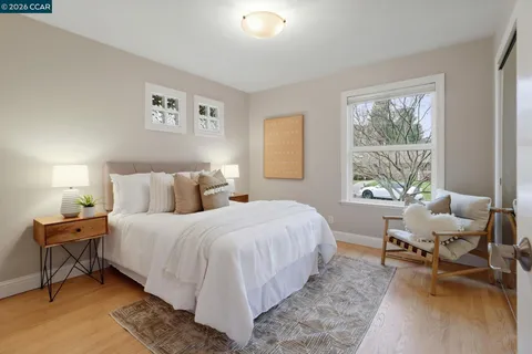 a bedroom with a bed and a table