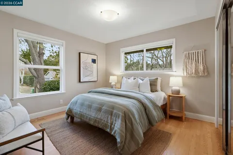 a bed room with a bed and a window