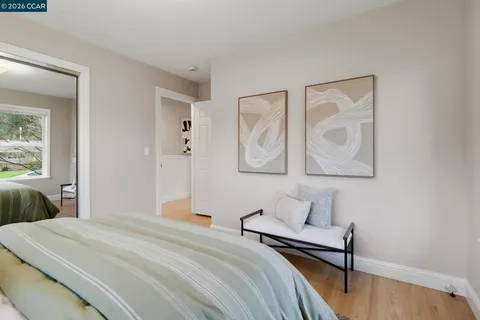 a bedroom with bed and window