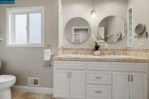 a bedroom with a large bed and a large window