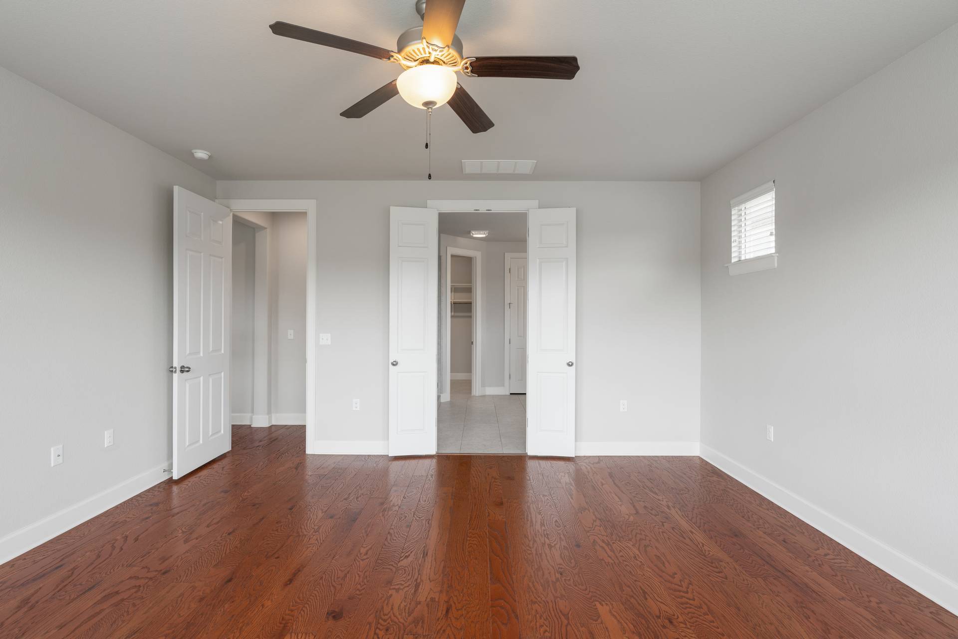 3516 Venezia View Leander, TX 78641 - Photo 30 of 40 Unfurnished bedroom featuring dark wood finished floors and a ceiling fan