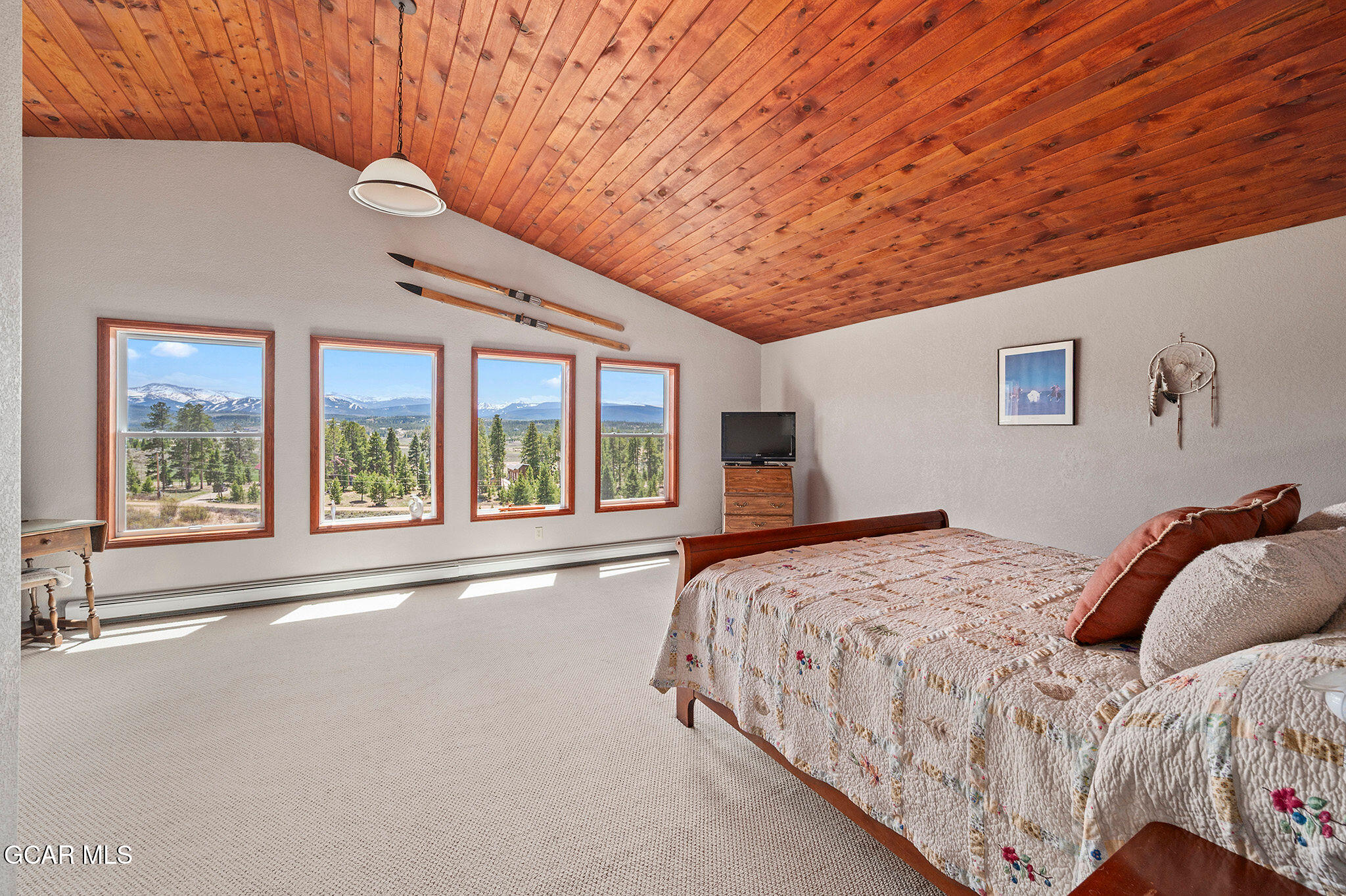 732 Gcr 8311/ Clayton Ranch Road Tabernash, CO 80478 - Photo 36 of 65 a bedroom with a large bed and a large window