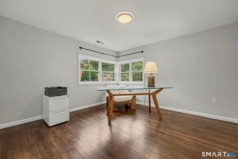 a room with furniture and a wooden floor