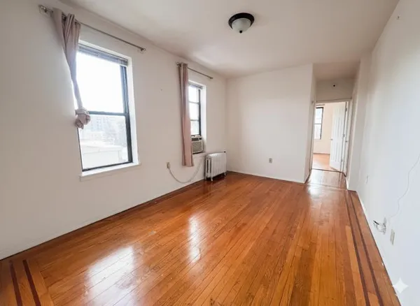 a kitchen with a sink window and cabinets