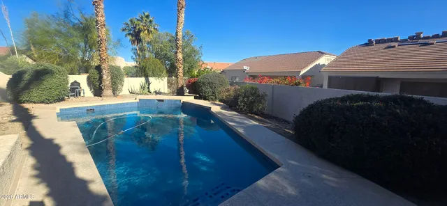 a view of balcony with two potted plants