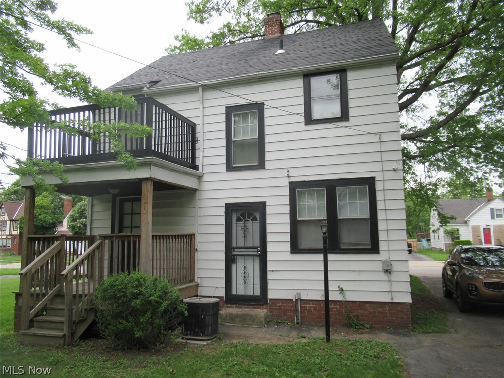 3824 East Antisdale Road Cleveland, OH 44118 - Photo 4 of 27 White siding exterior with dark trim windows
