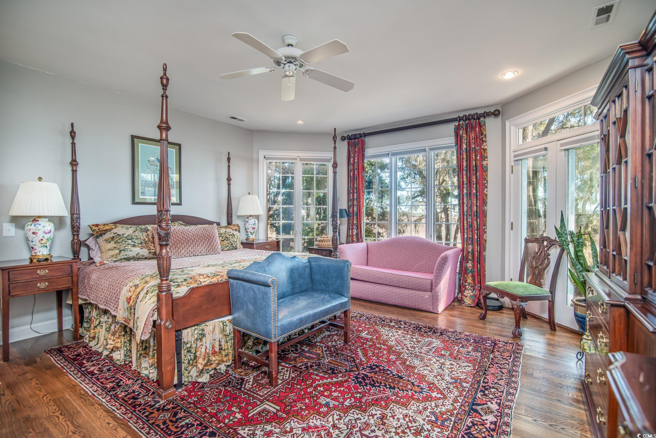 762 Wraggs Ferry Road Georgetown, SC 29440 - Photo 25 of 33 Bedroom with access to outside, visible vents, and wood finished floors