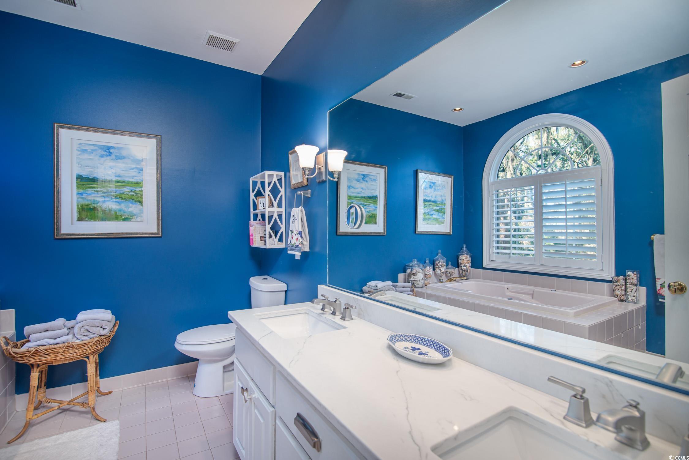 762 Wraggs Ferry Road Georgetown, SC 29440 - Photo 27 of 33 Bathroom with visible vents, a sink, toilet, and tile patterned floors
