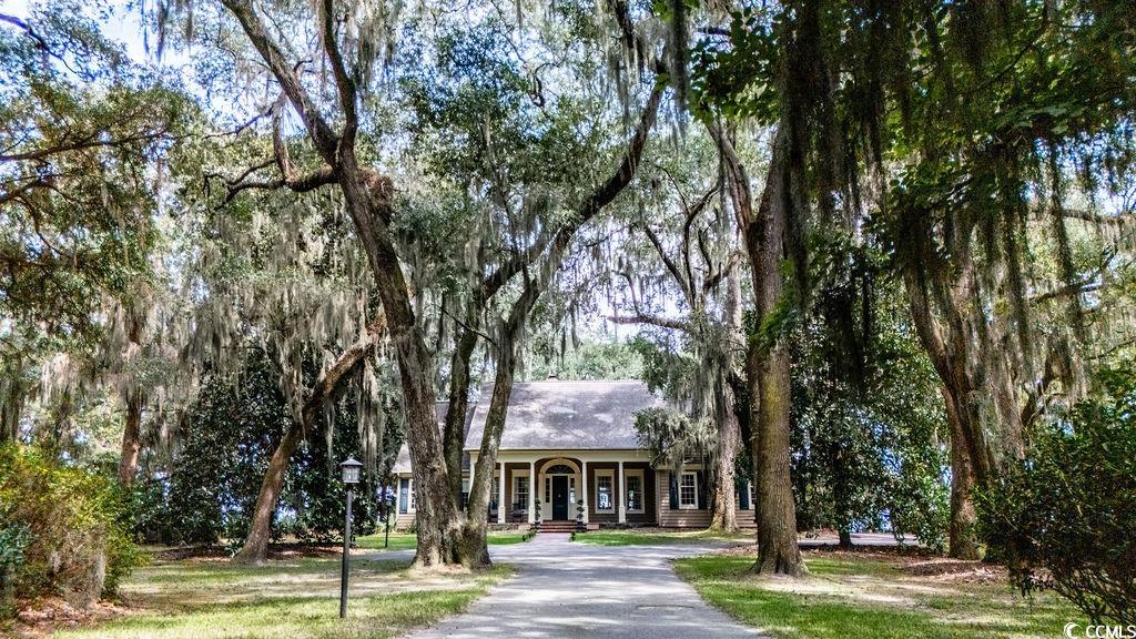 762 Wraggs Ferry Road Georgetown, SC 29440 - Photo 3 of 33 View of front facade with a porch