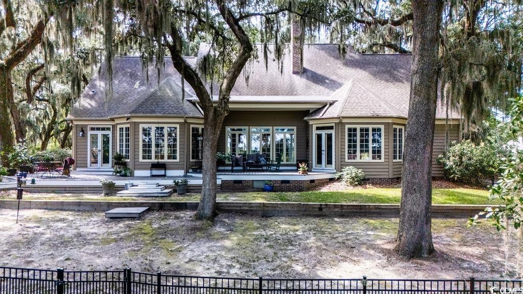 762 Wraggs Ferry Road Georgetown, SC 29440 - Photo 8 of 33 Back of property featuring french doors, a shingled roof, crawl space, a patio, and a wooden deck