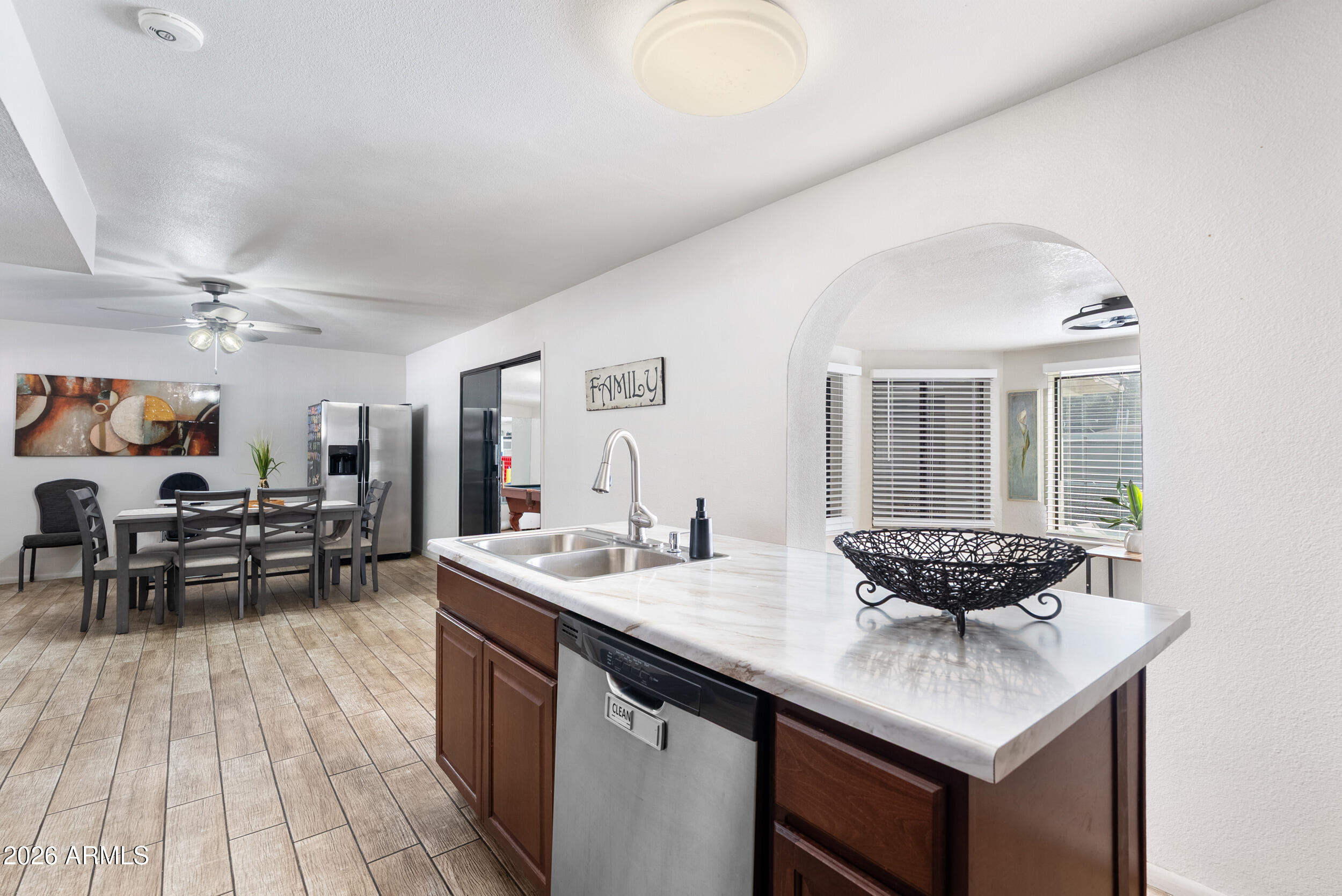 3631 West Colter Street Phoenix, AZ 85019 - Photo 14 of 45 a kitchen with a counter space and a sink