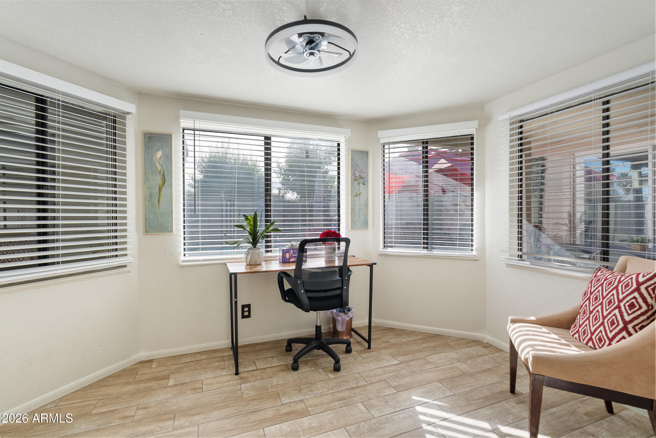 3631 West Colter Street Phoenix, AZ 85019 - Photo 19 of 45 a view of a livingroom with workspace and a window
