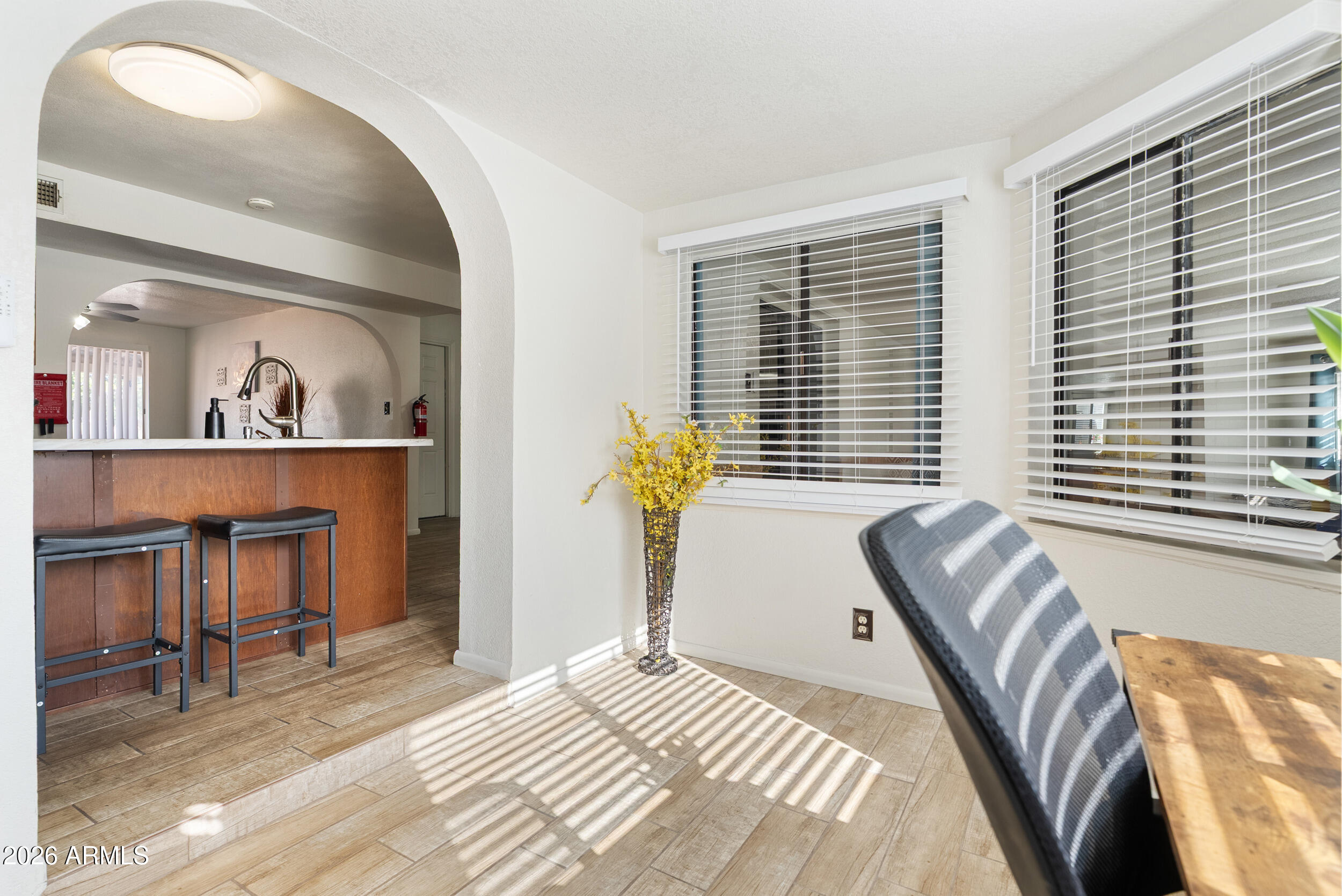 3631 West Colter Street Phoenix, AZ 85019 - Photo 20 of 45 a bedroom with a bed and a cabinets