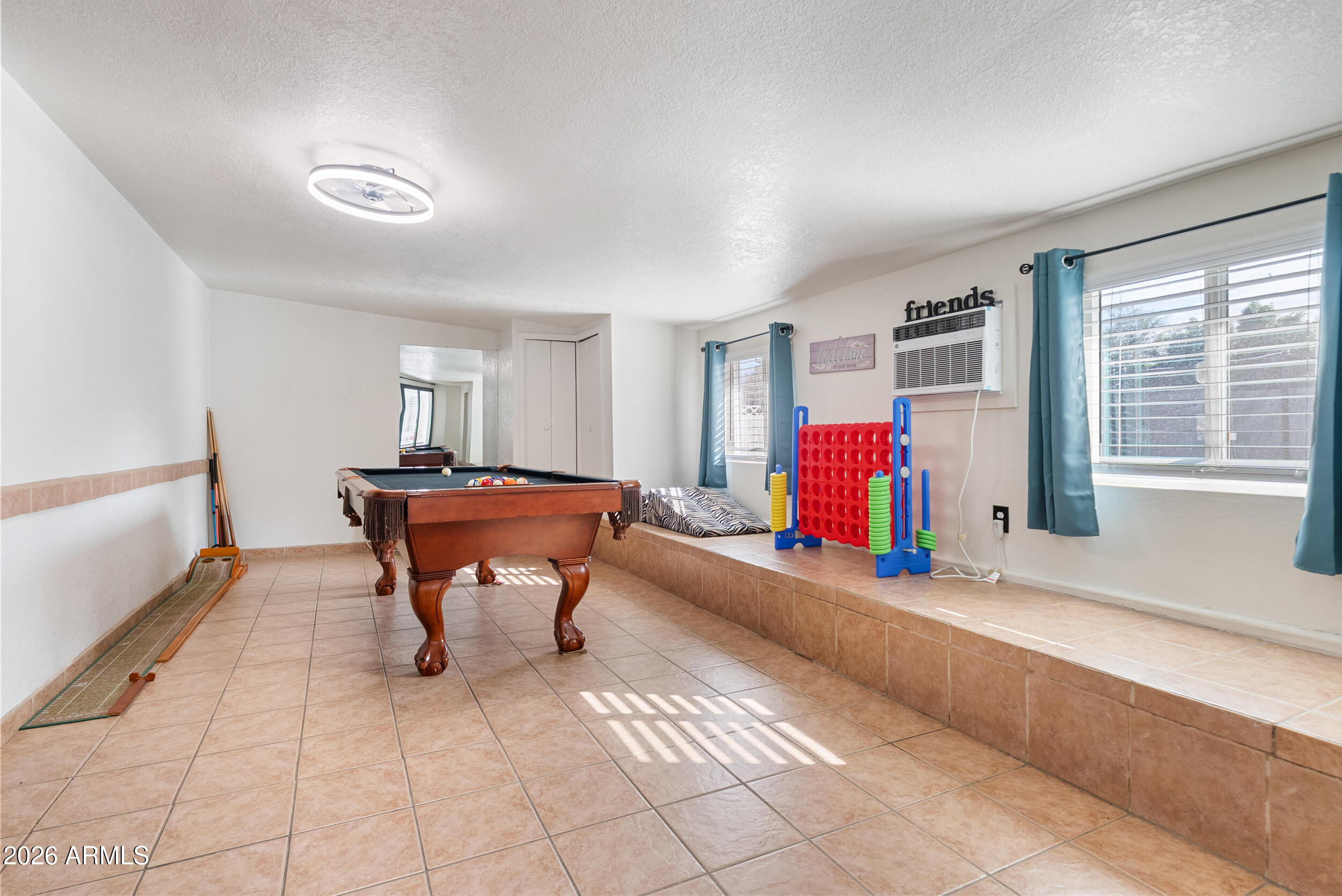3631 West Colter Street Phoenix, AZ 85019 - Photo 21 of 45 a living room with furniture and a window