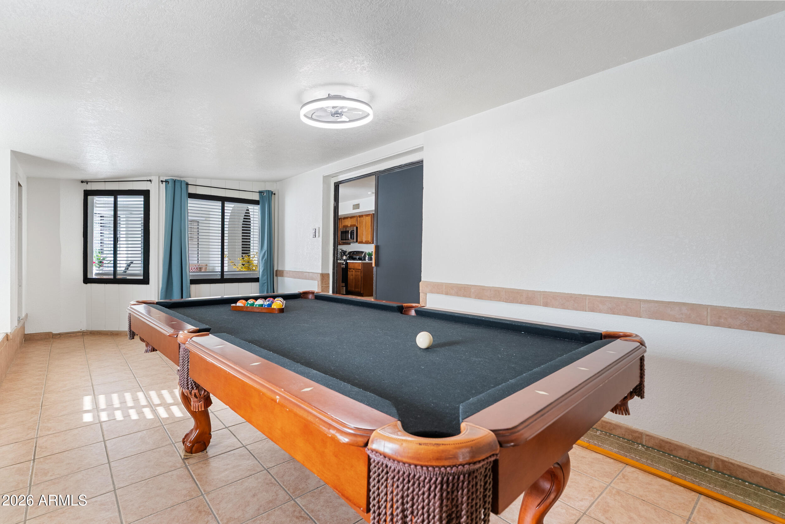 3631 West Colter Street Phoenix, AZ 85019 - Photo 22 of 45 a room with pool table table and windows