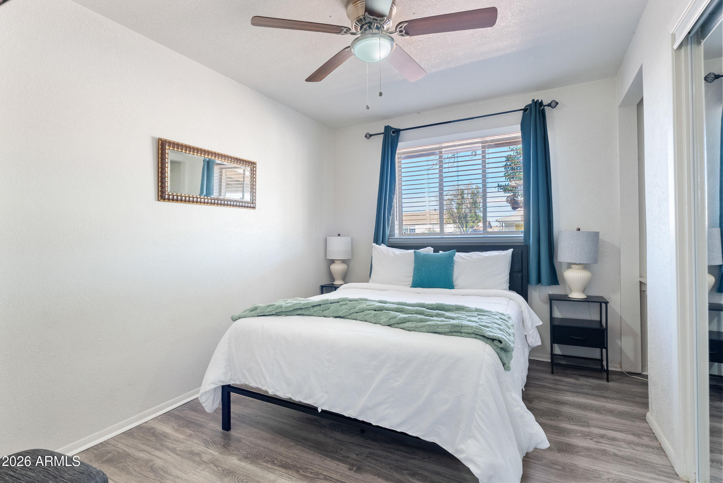 3631 West Colter Street Phoenix, AZ 85019 - Photo 23 of 45 a bedroom with a bed and window