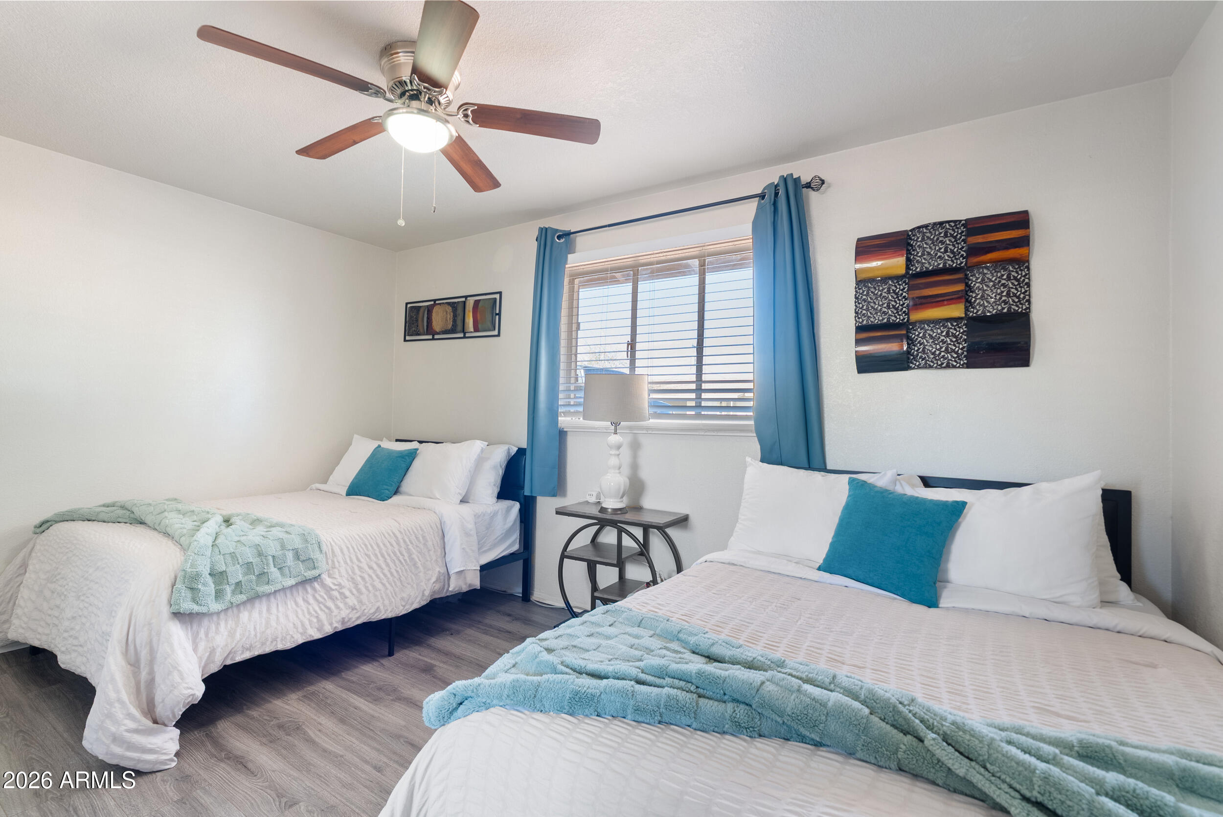 3631 West Colter Street Phoenix, AZ 85019 - Photo 26 of 45 a bedroom with bed and a window