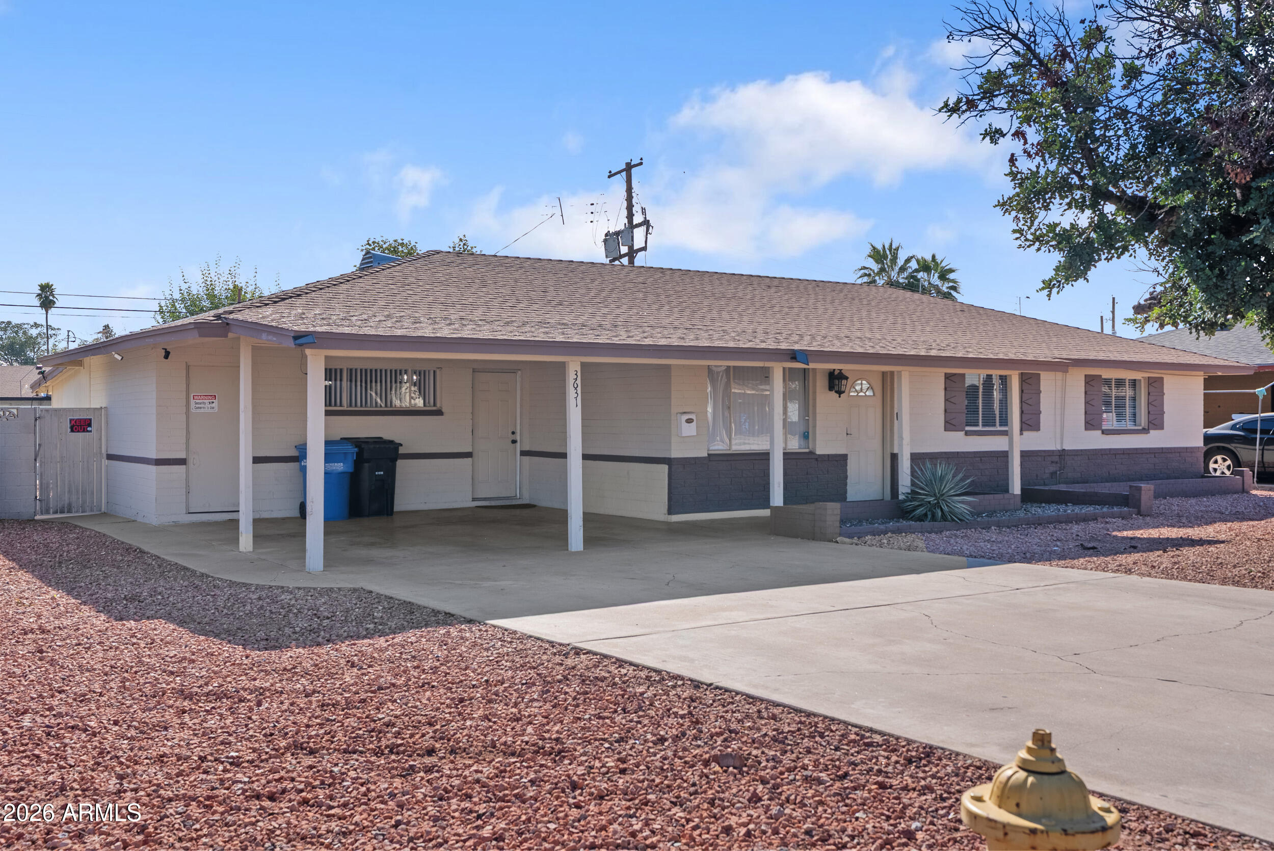 3631 West Colter Street Phoenix, AZ 85019 - Photo 2 of 45 a view of a house with a yard