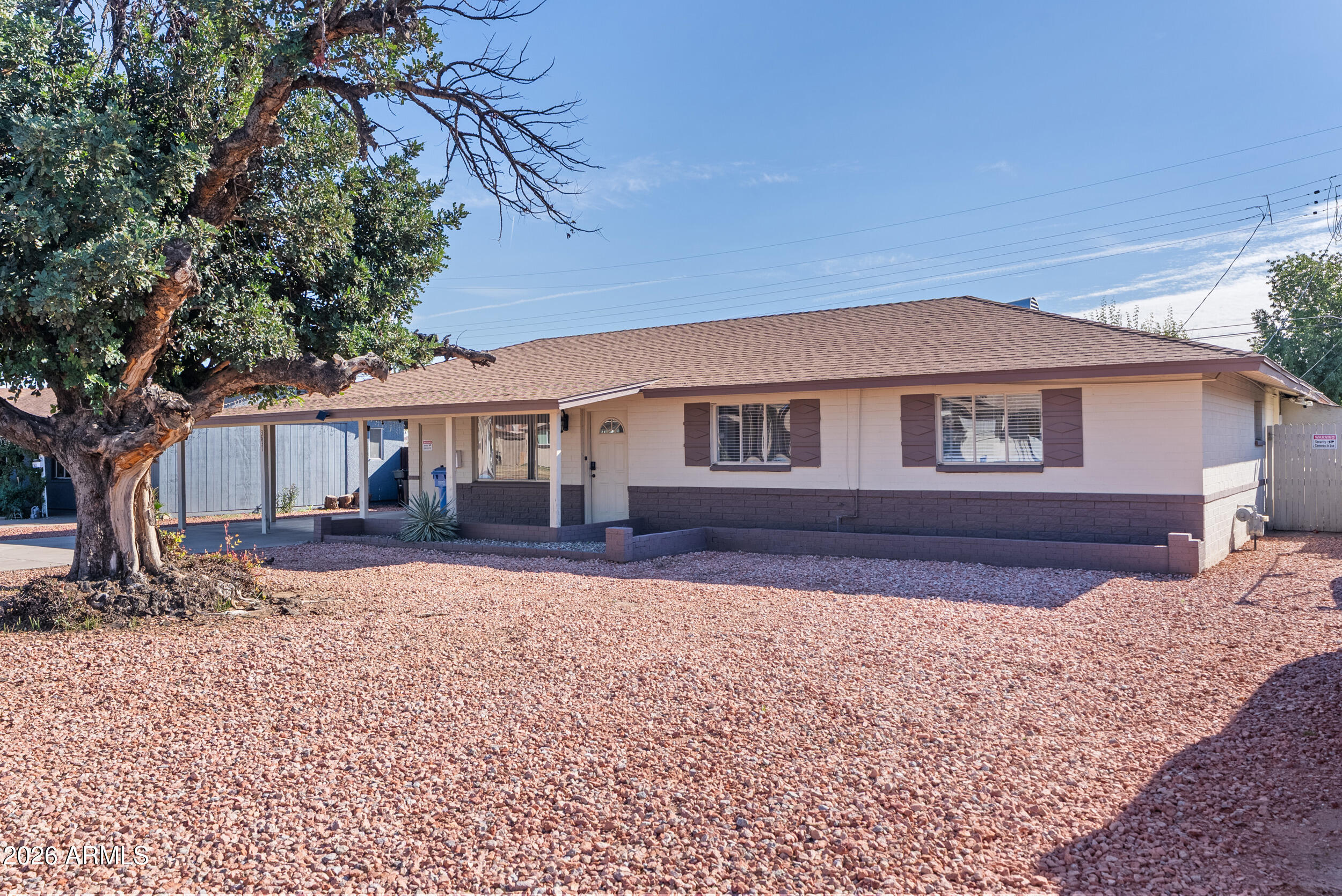 3631 West Colter Street Phoenix, AZ 85019 - Photo 3 of 45 a front view of a house with a yard