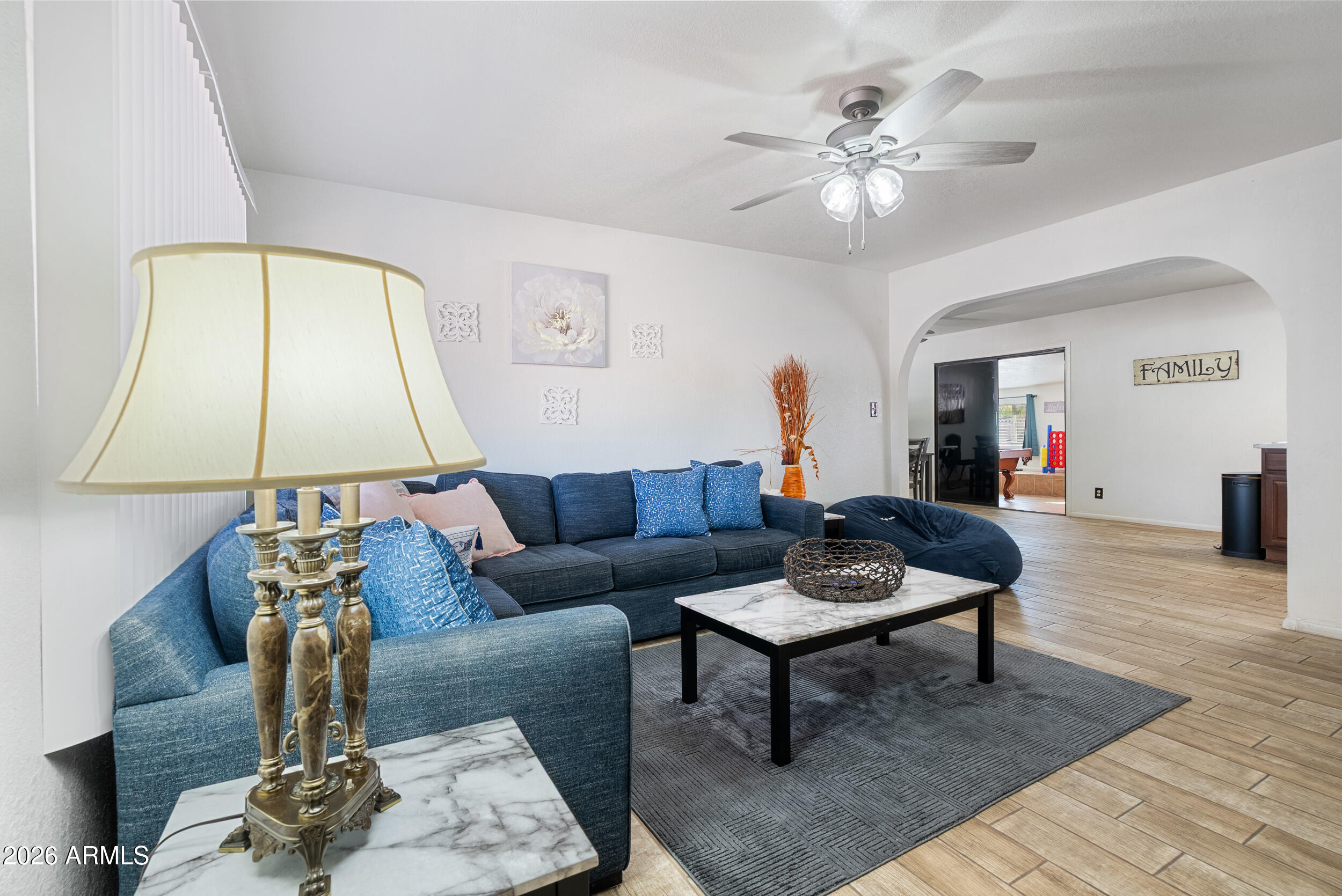 3631 West Colter Street Phoenix, AZ 85019 - Photo 4 of 45 a living room with furniture and a table