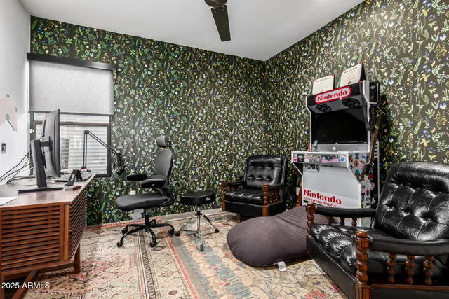 a living room with furniture a rug and a fireplace