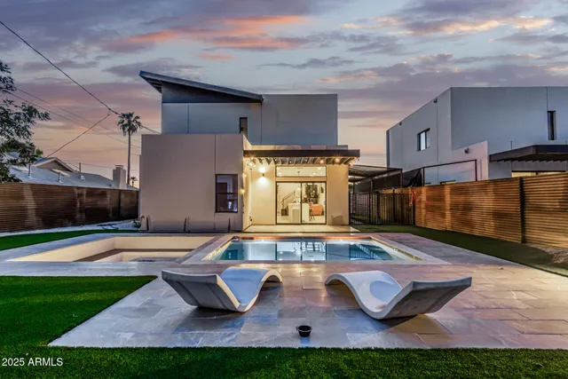 a view of yard with swimming pool outdoor seating