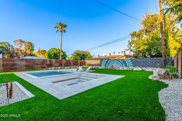 a view of swimming pool with outdoor seating