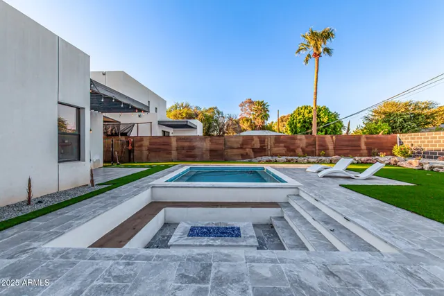 a view of a kitchen with a tub and a large window