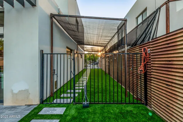 a view of a chairs and table in the patio