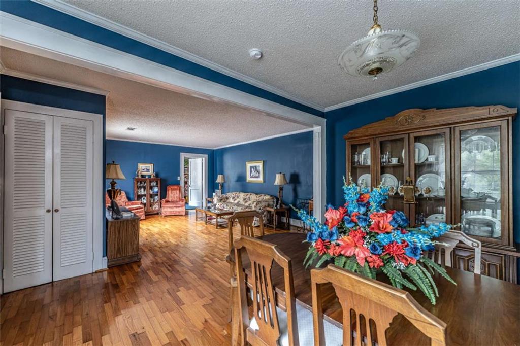 13 Spring Circle Southeast Lindale, GA 30147 - Photo 13 of 25 a view of a dining room with furniture wooden floor and chandelier