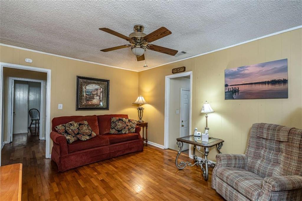 13 Spring Circle Southeast Lindale, GA 30147 - Photo 16 of 25 a living room with furniture and a wooden floor