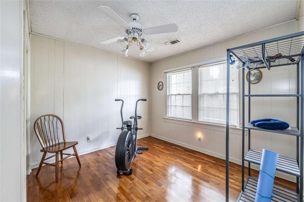 13 Spring Circle Southeast Lindale, GA 30147 - Photo 17 of 25 a view of an empty room with window and wooden floor