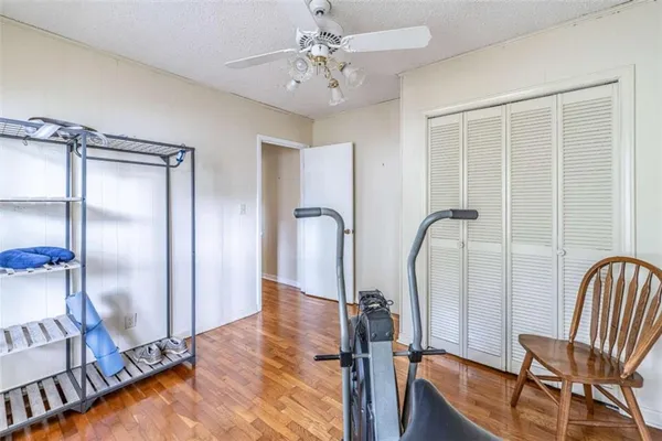a view of a room with furniture and wooden floor