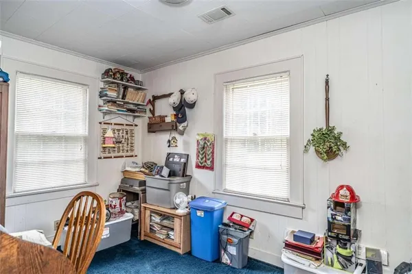 a bedroom with furniture and a window