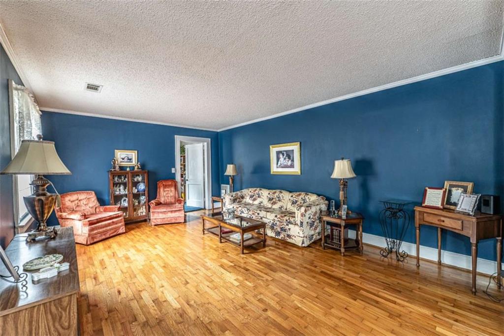 13 Spring Circle Southeast Lindale, GA 30147 - Photo 9 of 25 a bed room with furniture and a lamp