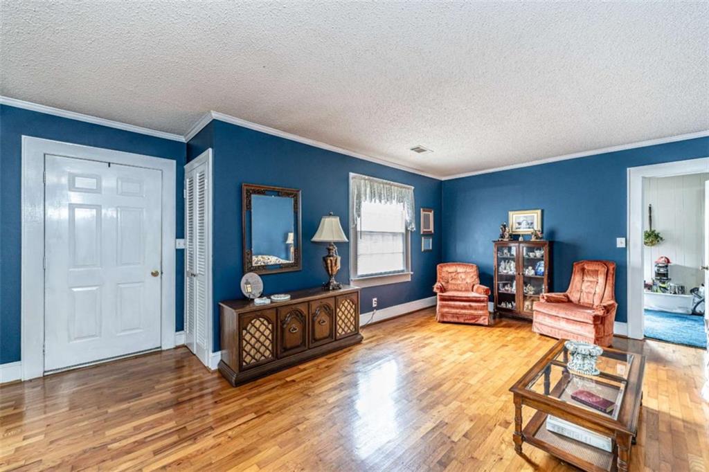 13 Spring Circle Southeast Lindale, GA 30147 - Photo 10 of 25 a living room with furniture and wooden floor