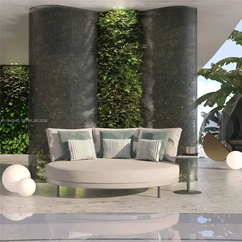 a view of a house with roof deck and seating space