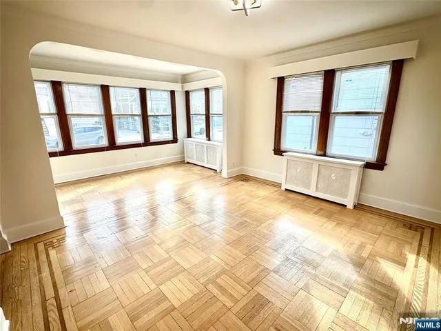 a view of an empty room with glass door