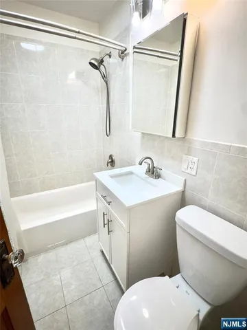 a bathroom with a sink a toilet and a bathtub