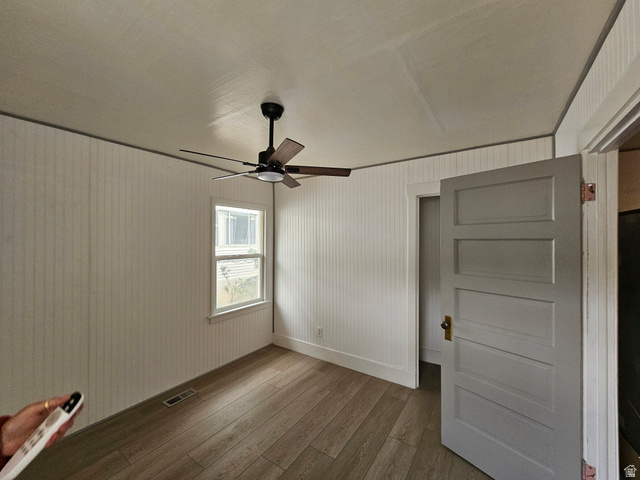 744 Royal Street Helper, UT 84526 - Photo 8 of 33 Unfurnished bedroom with dark wood-type flooring and a ceiling fan