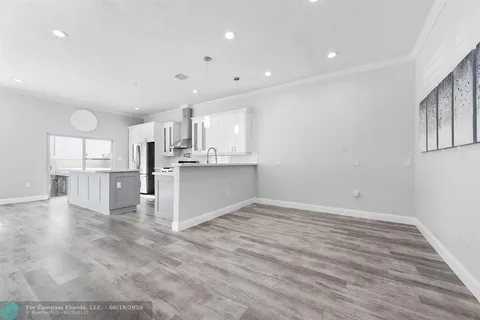 a view of kitchen with wooden floor