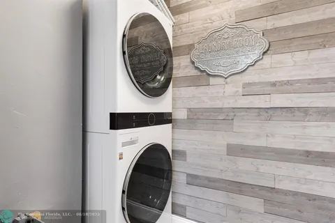 a close view of a utility room with dryer and washer